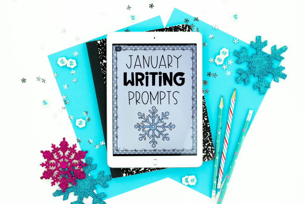 Snowflakes, pencils and iPad with January Writing Prompts on it 